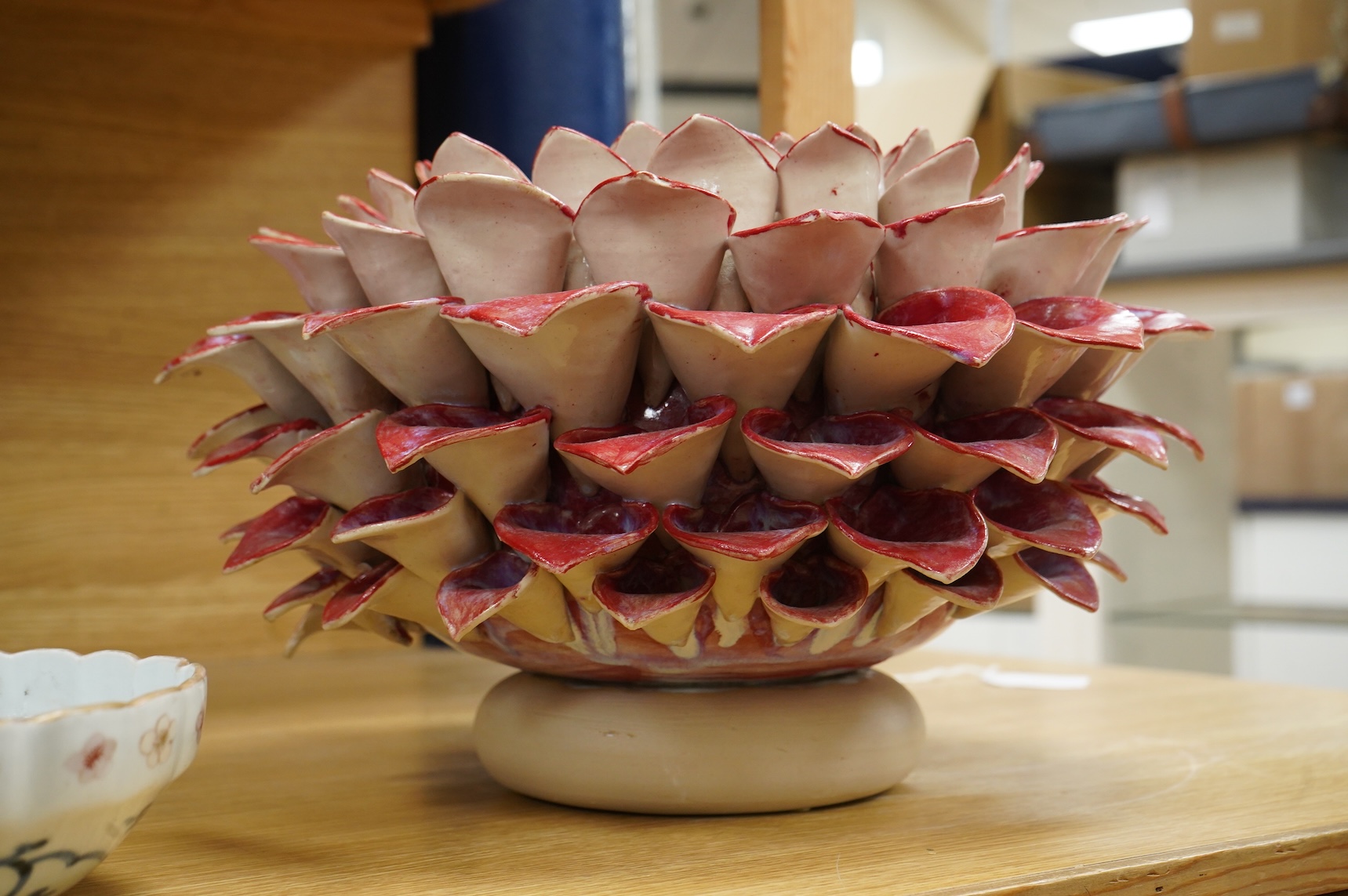 Frances Doherty, a Bishop's Pom Pom ceramic sculpture, with red glaze, 40cm wide